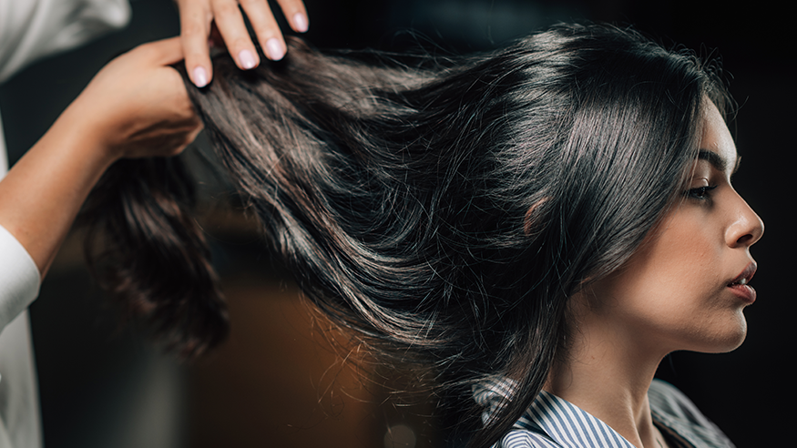 Woman getting her hair cut in relaxing home salon