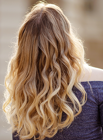 Woman showing new Balayage hair