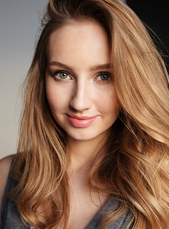 Woman showing glossy hair.