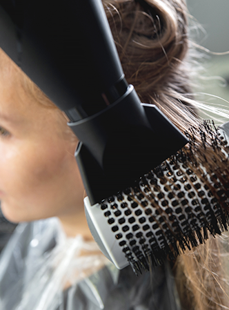 Beautiful hair being blow dried.