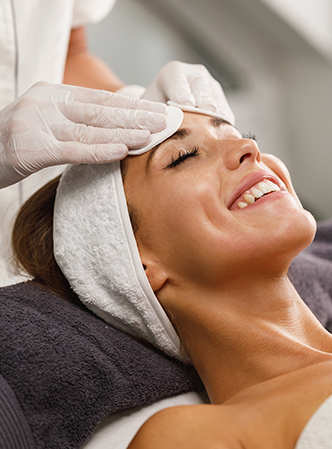 Relaxed woman getting a facial.
