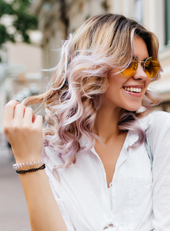 Smiling woman with highlights and tints.